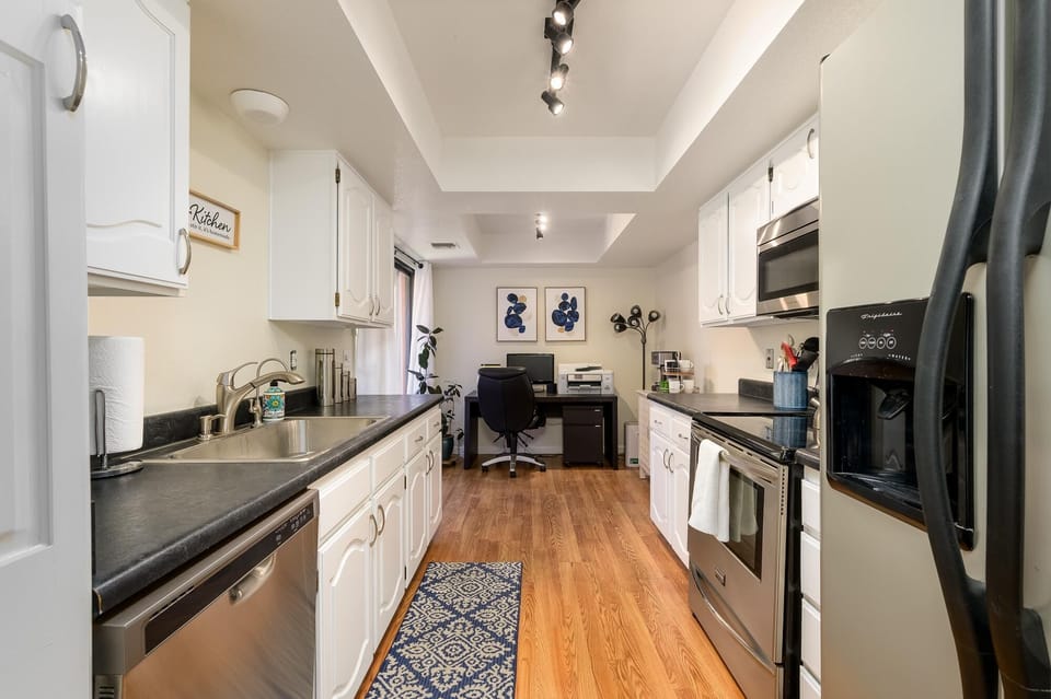 Galley kitchen fully stocked.