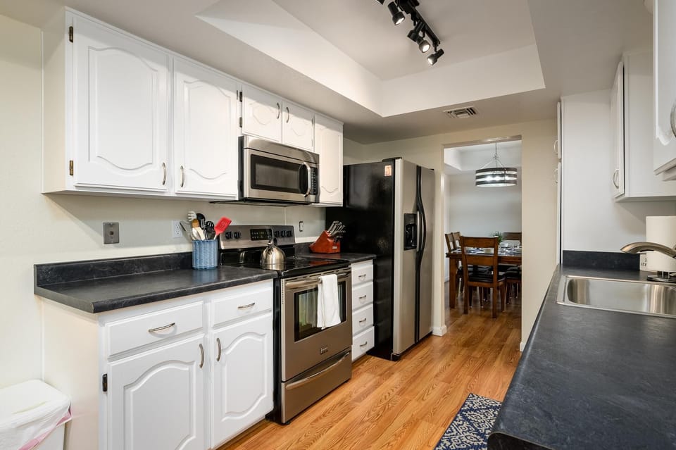 Stainless steel appliances in the kitchen.