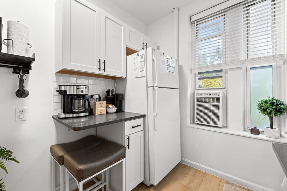 Cozy kitchenette with a full coffee station, including a drip maker, kettle, and all the essentials you need to start your morning right.