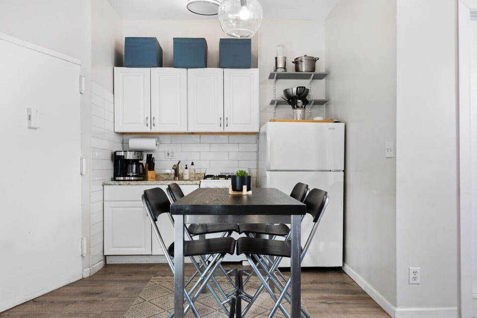 Kitchen is stocked with basic cooking and dining amenities, great for short or long stays.