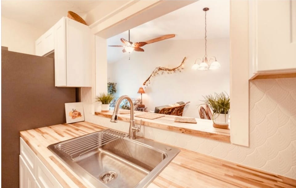 Fully stocked kitchen with breakfast counter.