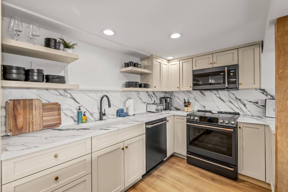 Contemporary kitchen design with spacious prep areas and natural wood accents