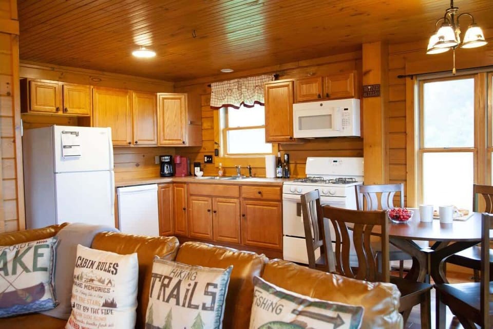 Kitchen – Plenty of counter space and natural wood style.