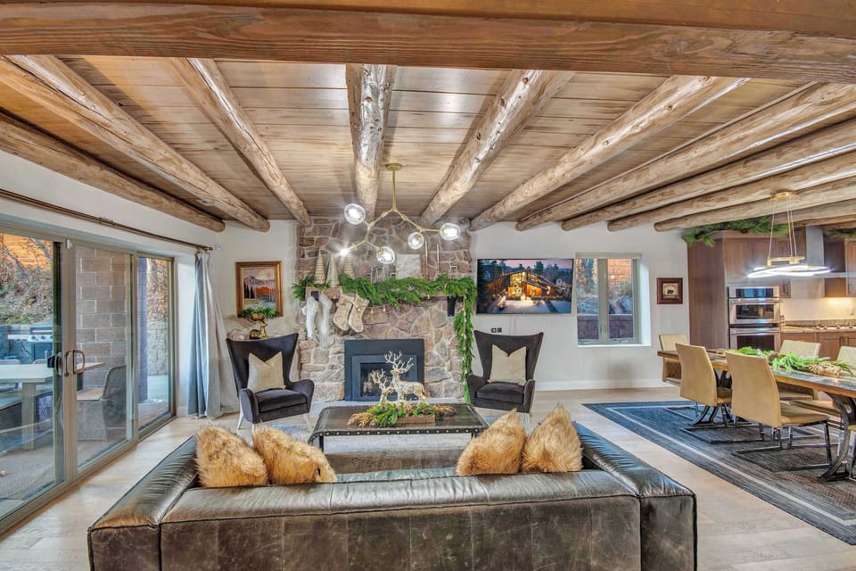 Living Room with sofas, tv, fireplace, walk out to porch (main level)