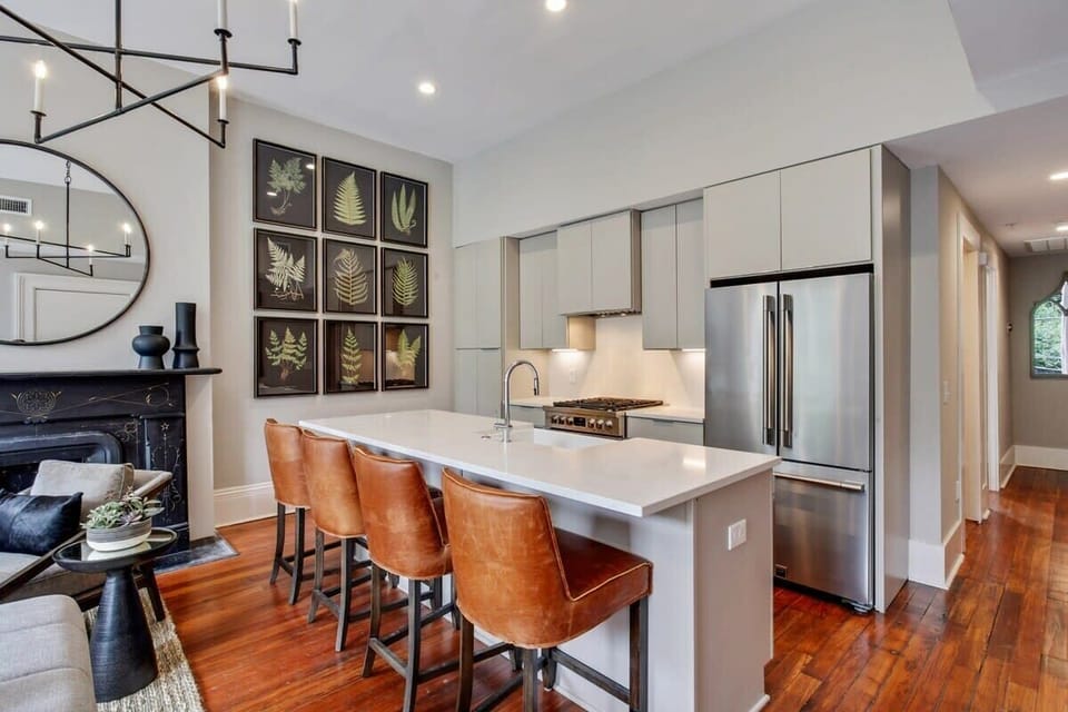  Kitchen | Open Concept Kitchen with Island and Bar Seating | Second Floor of Building — Unit on One Level