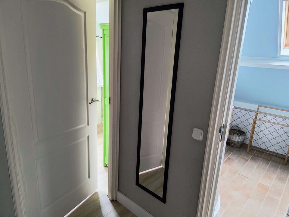 Upper floor hallway with mirror