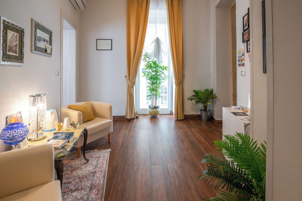 Basic Room, 1 Bedroom | Living area | Flat-screen TV