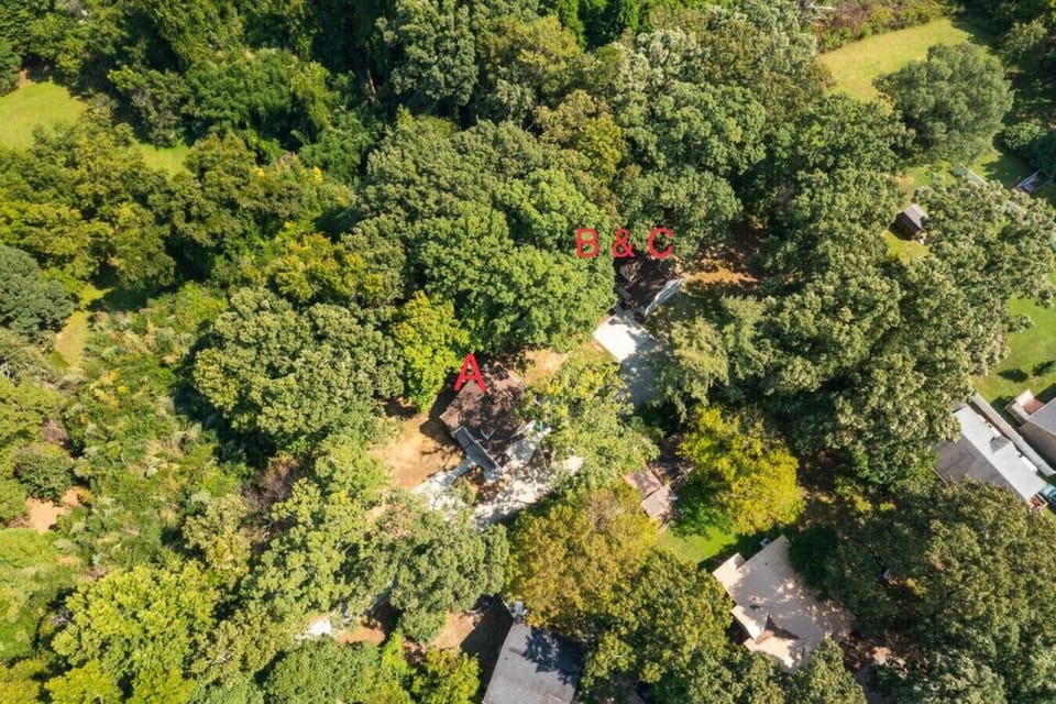 Enjoy the private and wooded surroundings of Tranquility Cottage - marked A, Quietude Place and Serenity Studio - marked B & C.