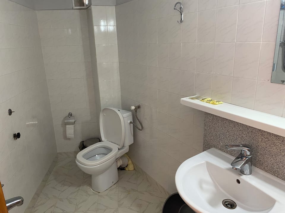 Shower, rainfall showerhead, towels, soap
