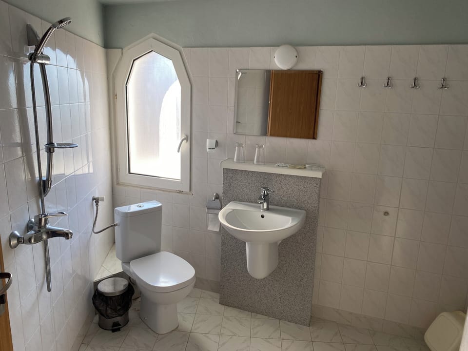 Shower, rainfall showerhead, towels, soap