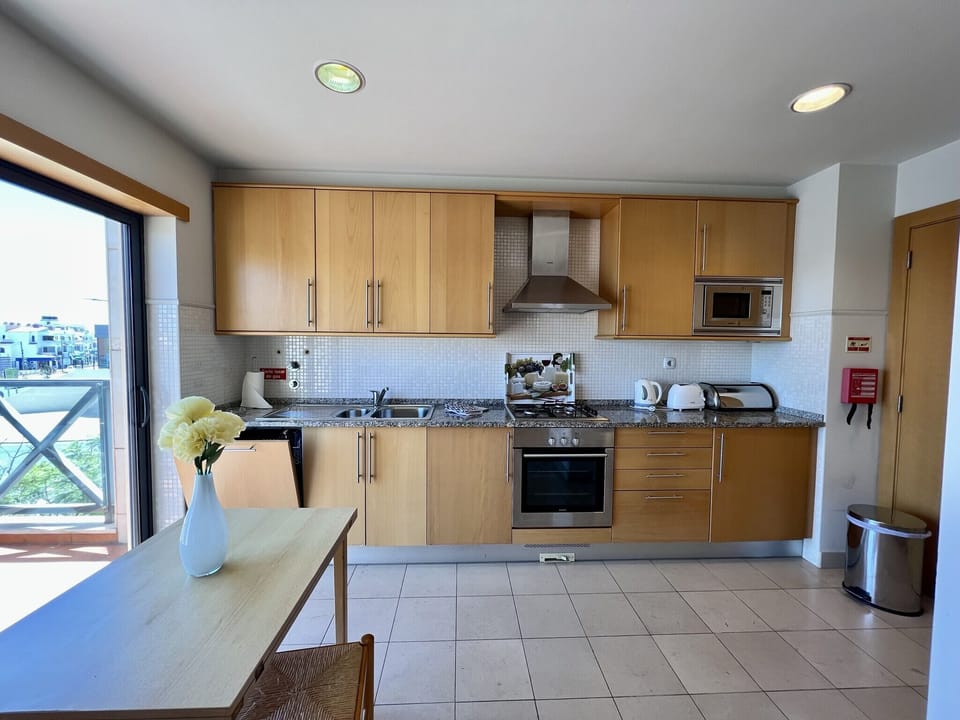 Apartment, 2 Bedrooms, Pool Access | Private kitchen | Coffee/tea maker, microwave, oven, dishwasher