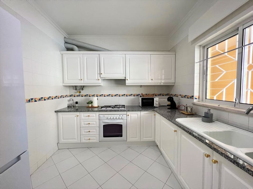 Apartment, 2 Bedrooms, Pool Access | Private kitchen | Microwave, oven, coffee/tea maker, electric kettle