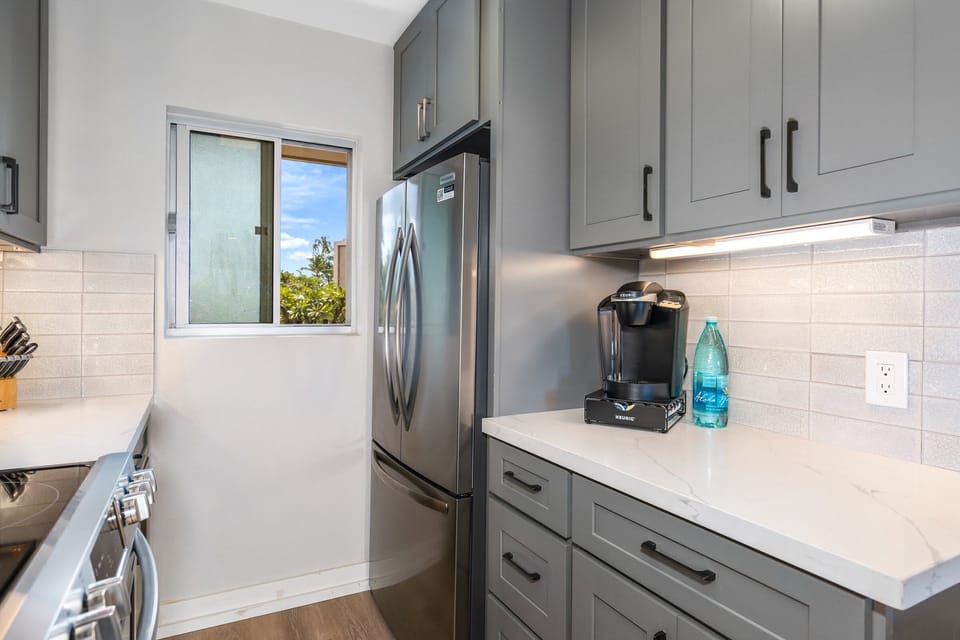 Luxury Condo | Private kitchen | Full-size fridge, microwave, oven, stovetop