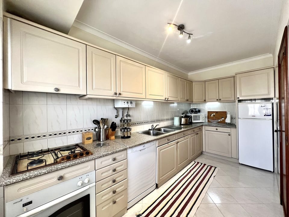 Apartment, 2 Bedrooms, Pool Access | Private kitchen | Coffee/tea maker, microwave, oven, dishwasher