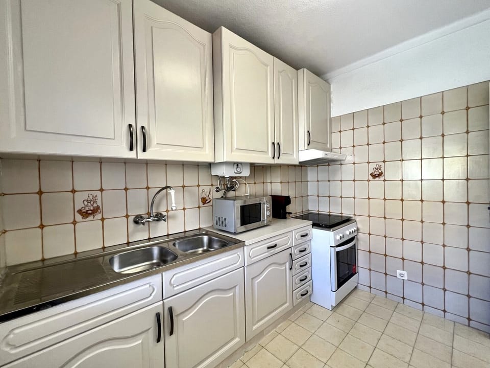 Apartment, 2 Bedrooms, Pool Access | Private kitchen | Microwave, oven, coffee/tea maker, electric kettle