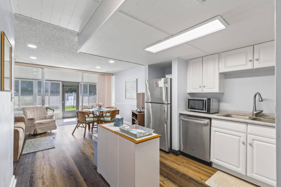 Kitchen Leading Into Sitting/Dining Area & Outdoor Patio
