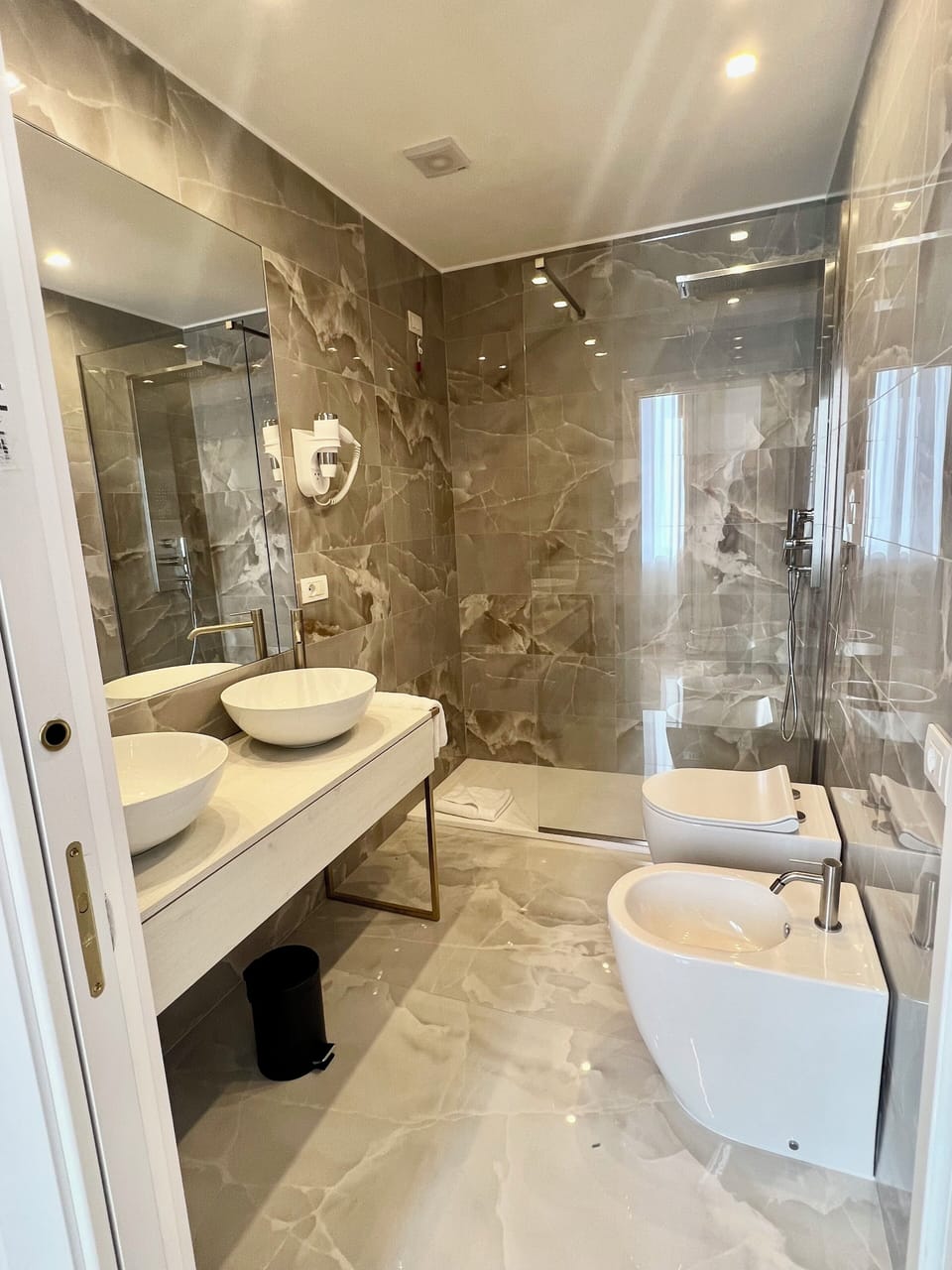 Shower, designer toiletries, hair dryer, bathrobes