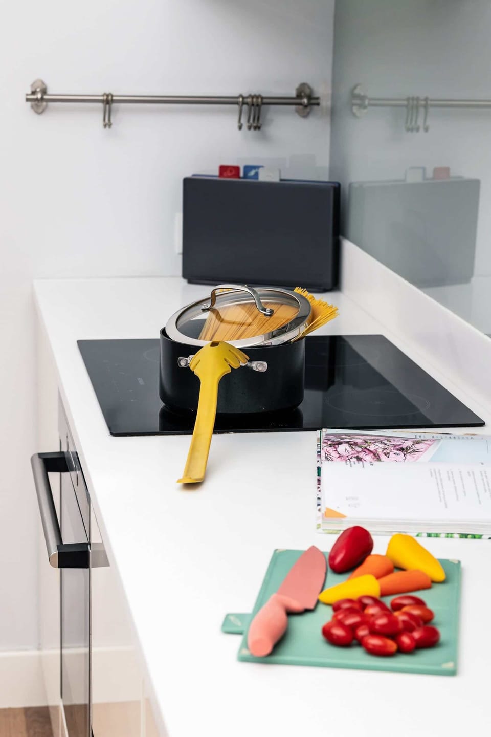 A modern kitchen sink and counter space with fresh produce, perfect for preparing meals.

