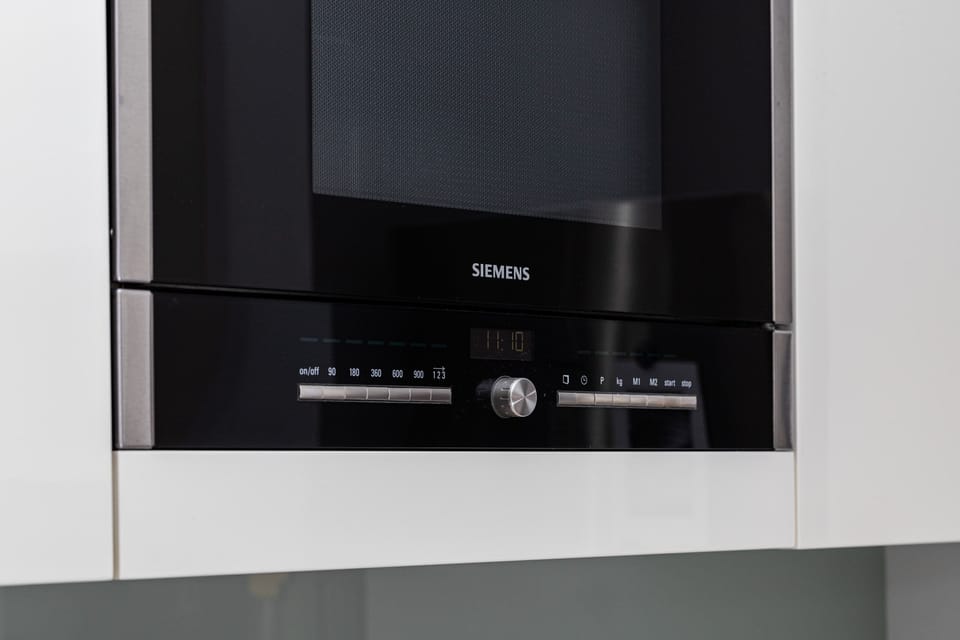 A close-up of a built-in oven, showcasing its modern and functional features.
