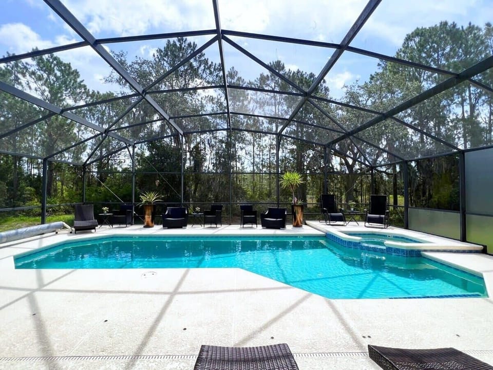 Soak up the Florida sunshine by your private pool and spa featuring sun loungers, comfortable seating, and no rear neighbors for added privacy. Optional pool heat is available for an additional fee.