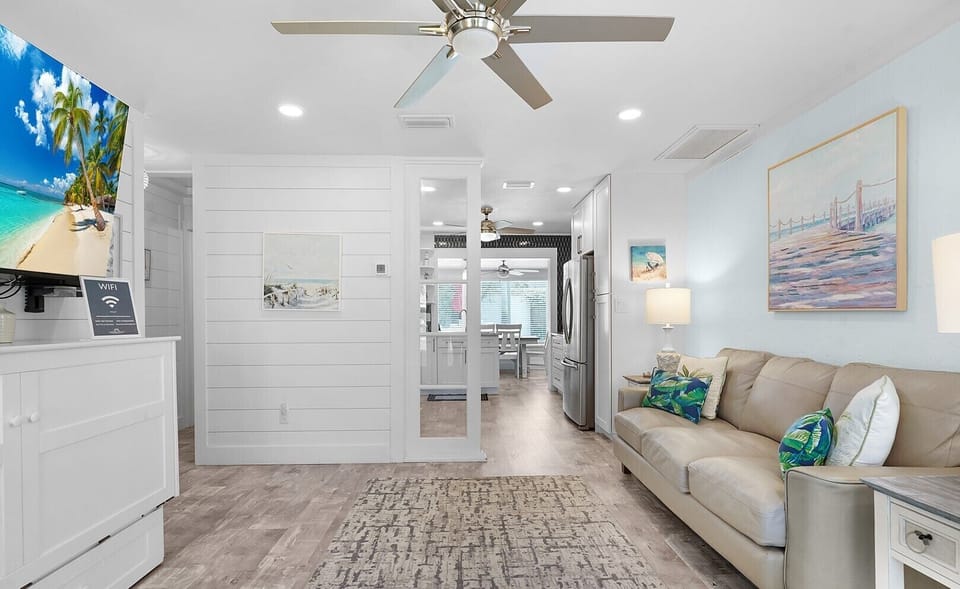 Living area looking to kitchen/dining