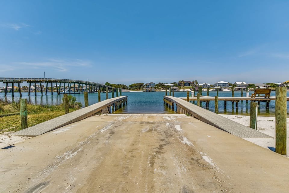Old River boardwalk and boat slip area at Wind Drift Orange Beach Alabama dual-waterfront vacation rental resort