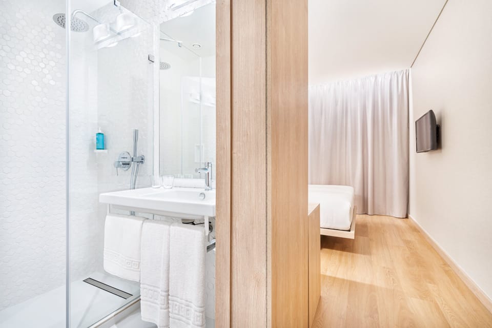 Shower, rainfall showerhead, hair dryer, towels