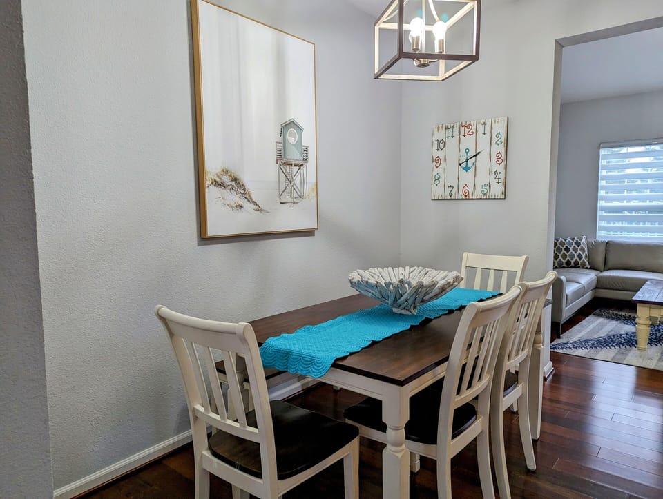38157 Greenport Lane, South Hampton - Dining - Open-concept dining space with a farmhouse-style table and vibrant turquoise runner, perfect for family meals.