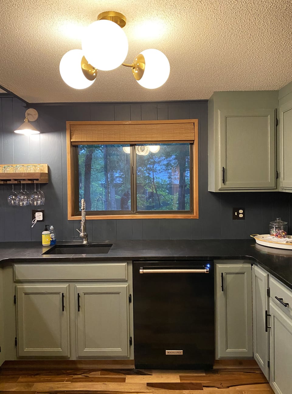 Remodeled kitchen with new granite countertops, sink and faucet.