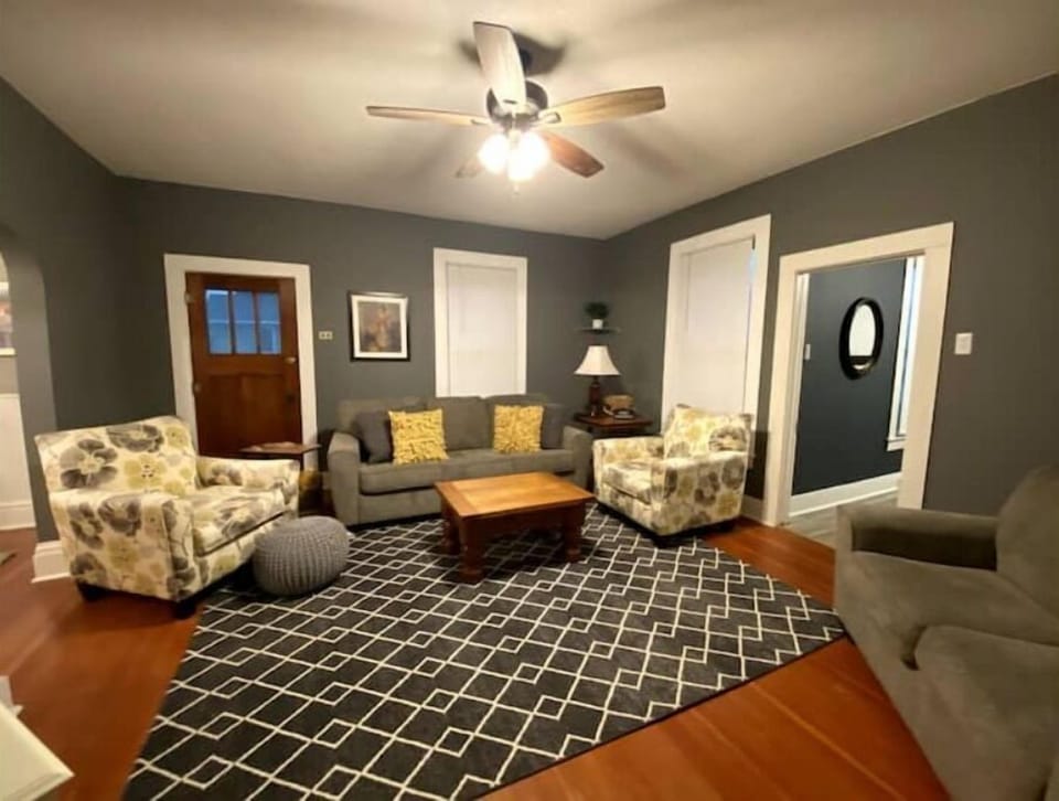 Spacious living room has ample seating to relax, watch TV, play games or visit.
