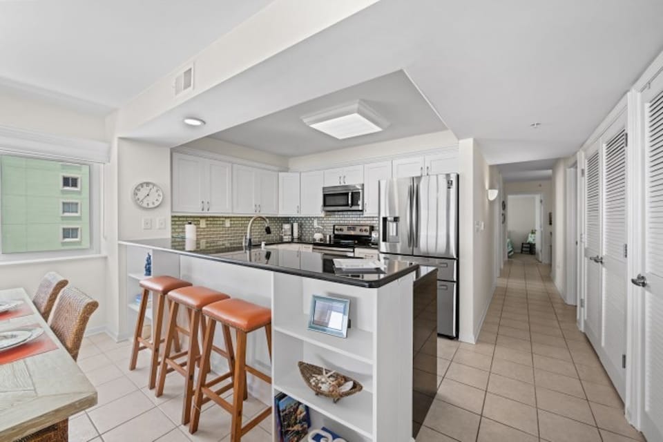 The kitchen counter provides additional space for serving snacks or meals.