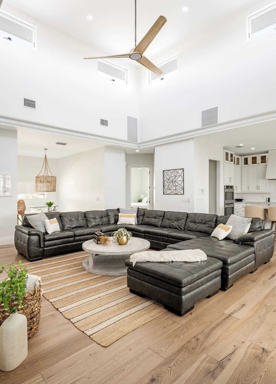 The seating area is a sanctuary of comfort, featuring a plush sofa  strategically arranged to encourage intimate conversations or accommodate larger gatherings. 