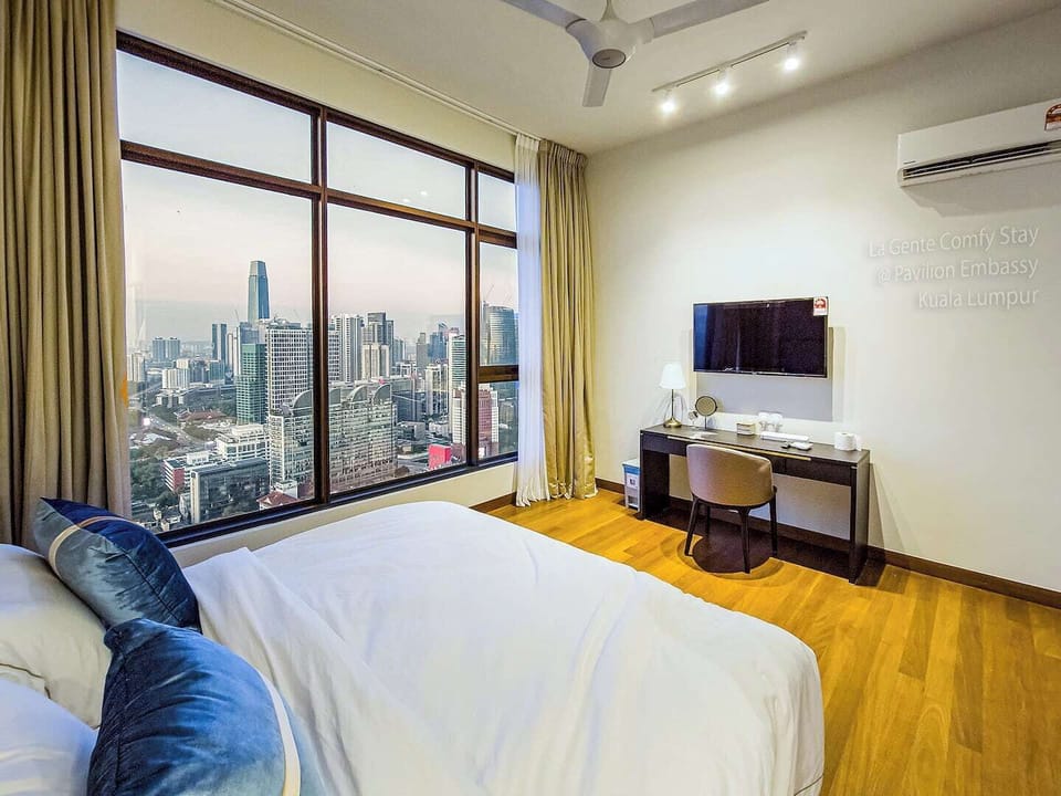 Our master bedroom with amazing city view, here at La Gente Comfy Stay, we use the highest quality Egyptian cotton bed linens, freshly laundered and served for every new guests, giving you the best sleeping experience 