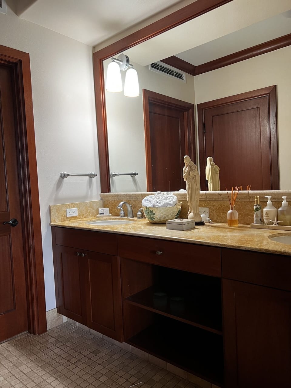 Bathroom off master bedroom includes 2 sinks.