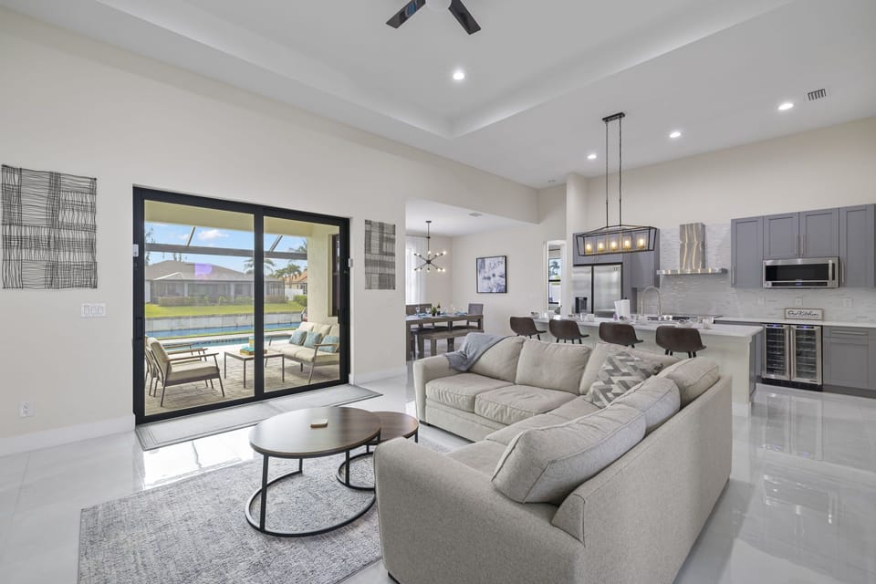 The living room has a beautiful view of the pool