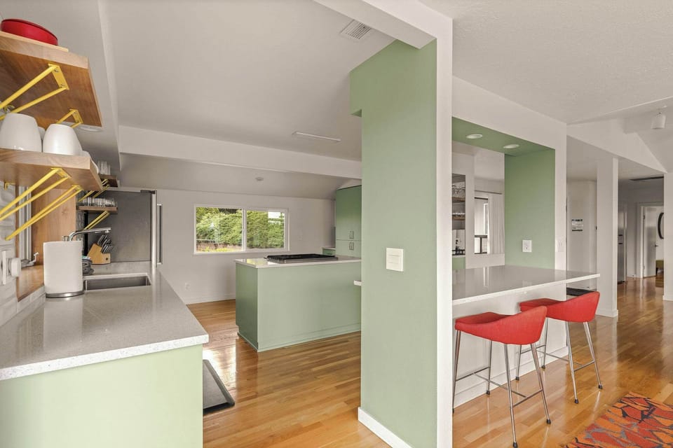 Flowing from the living room into the open modern kitchen to ensure no views are lost here. 