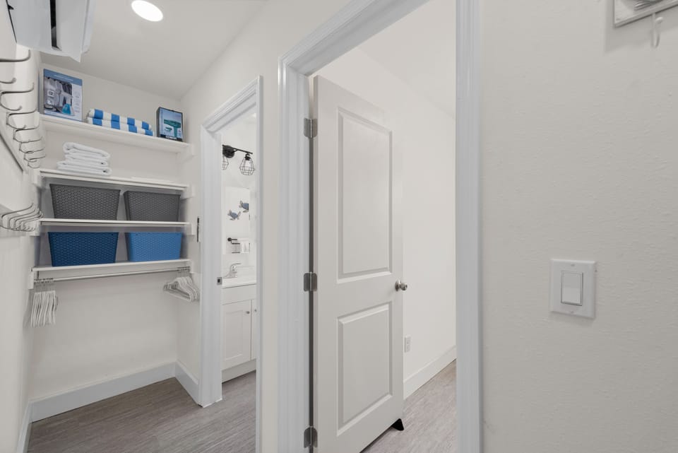 Hallway to Bathroom and office with storage Unit 1