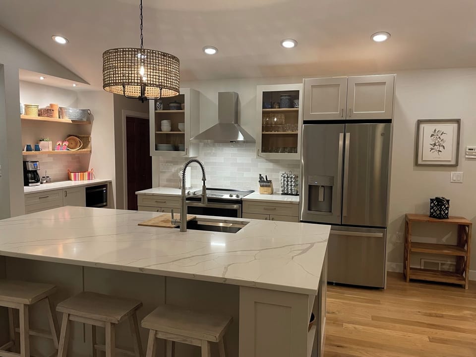 New kitchen with quartz countertops and counter-seating