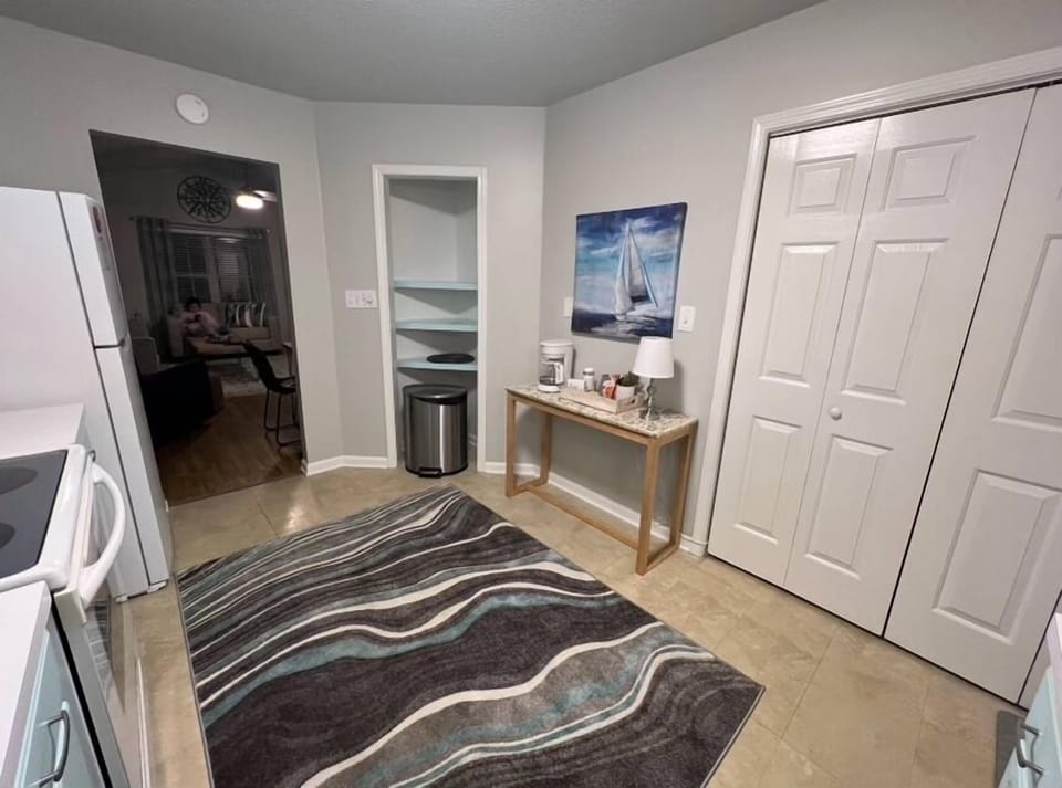 Well equipped kitchen w/ coffee bar. Utility closet with full size washer/dryer.