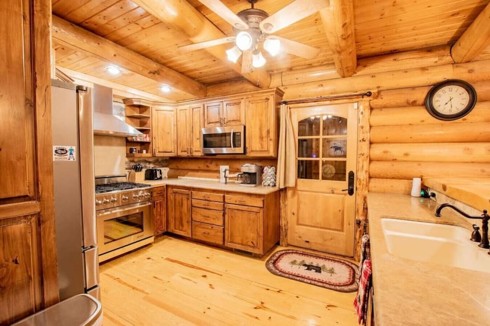 The well equipped kitchen is stocked with dining ware for 16, cookware, essentials, some spices, and complementary coffee.