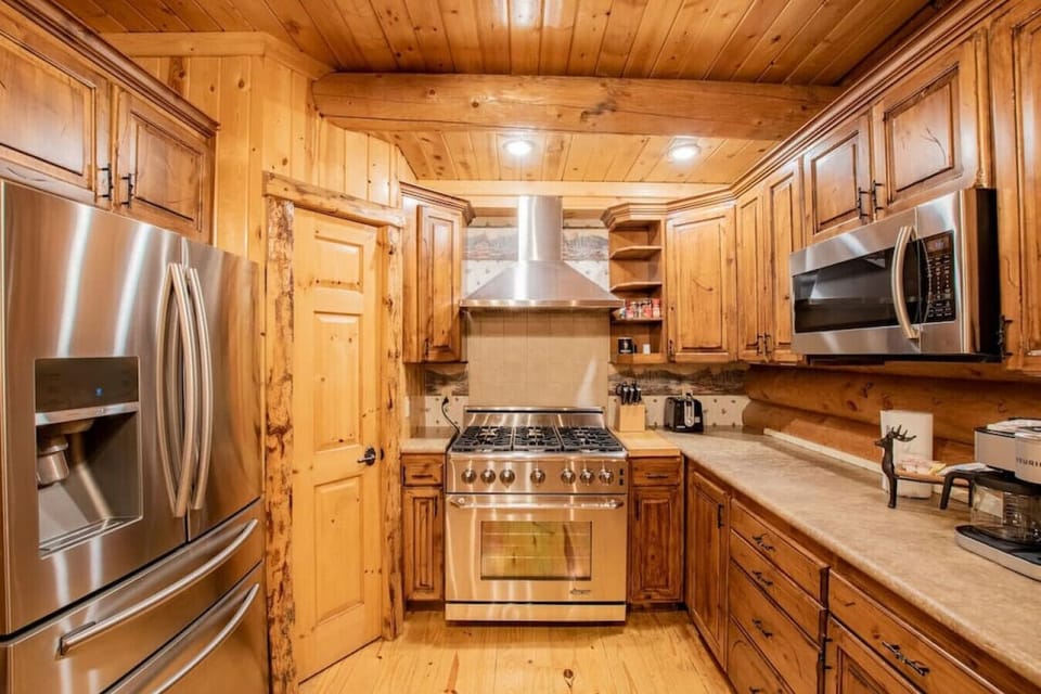 The well equipped kitchen is stocked with dining ware for 16, cookware, essentials, some spices, and complementary coffee.