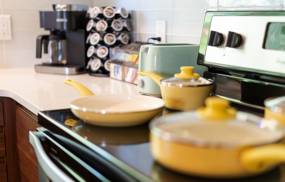 Fully equipped kitchen with pots and pans, and other kitchen appliances