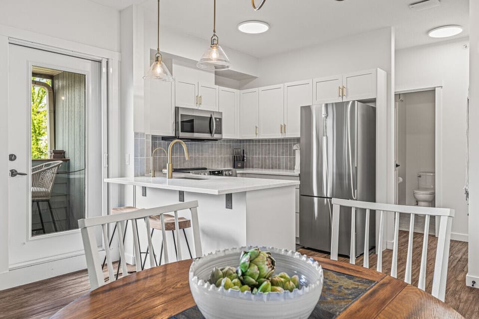 Stunning new kitchen with white marble countertops and all new appliances