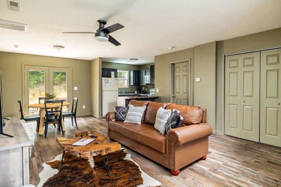 Our living area is definitely the ultimate relaxation spot. From the inviting couch to the soothing breeze of the ceiling fan, it's the perfect place to unwind after a long day.
