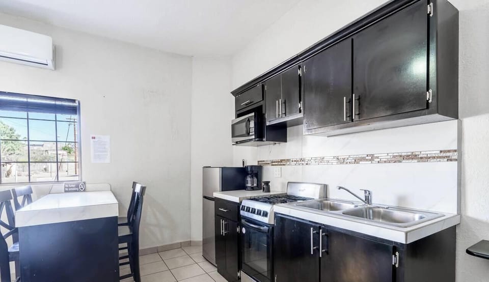 Well-equipped kitchen at Casa Mar de Cortez in downtown San Felipe Baja California Mexico — stove, fridge, microwave, and counter space included.