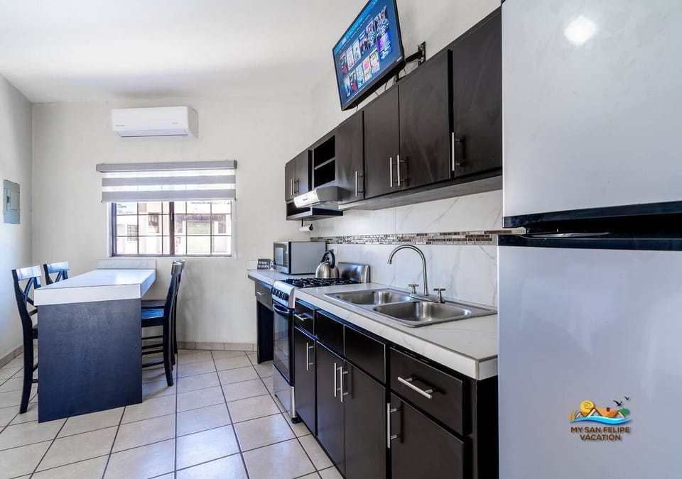 Enjoy your favorite shows on the flat screen TV in the spacious sixth bedroom of Casa Mar de Cortez, a downtown San Felipe BC rental.