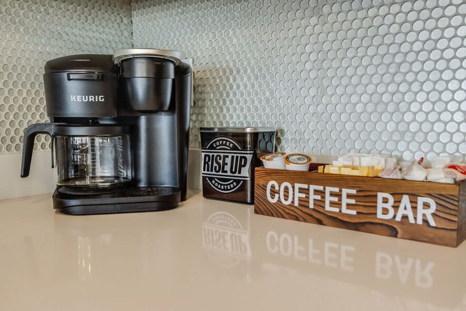 Coffee Bar w/ Keurig Duo for K-cups or drip pot. French press too. Free locally roasted coffee is supplied.
