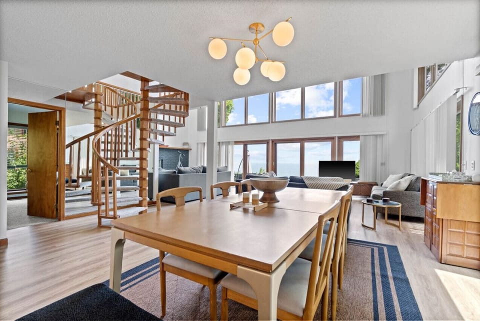 Enjoy a family dinner with a view! Spiral staircase leads to upstairs bedrooms