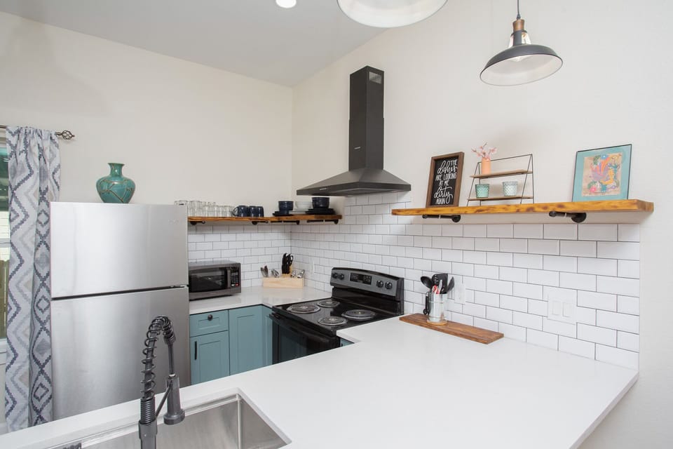 Experience the joy of cooking in our beautifully designed kitchen,