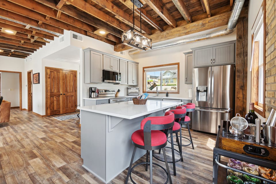 Spacious kitchen with bar and island.  Has all of the amenities needed for meals